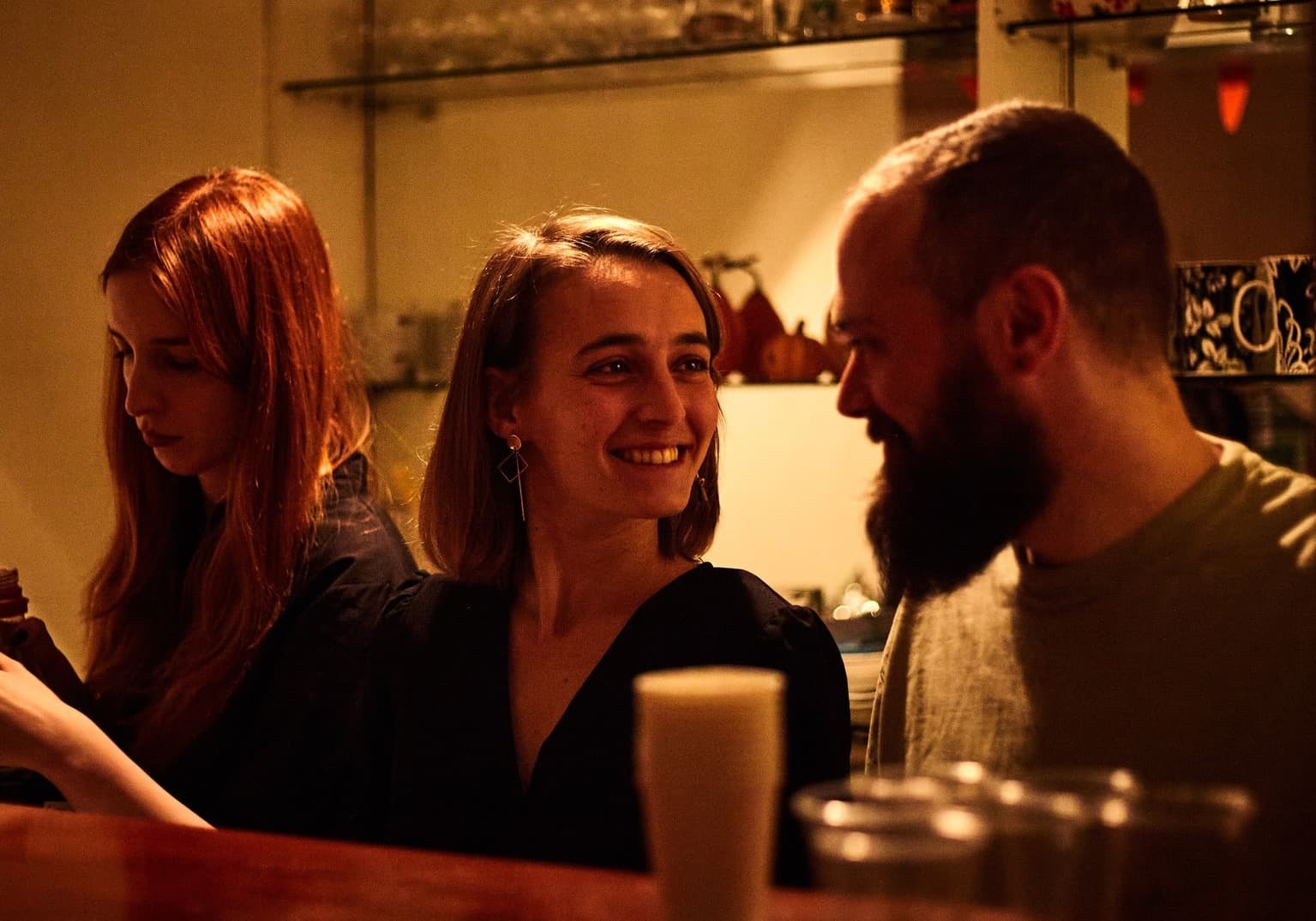 Folks talking at the bar